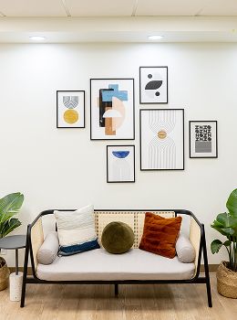 Modern living room with artwork and cozy decor.