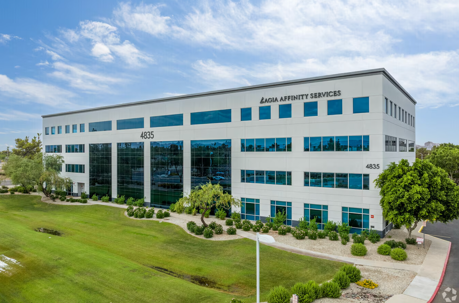 Modern reception area with greenery and decor.