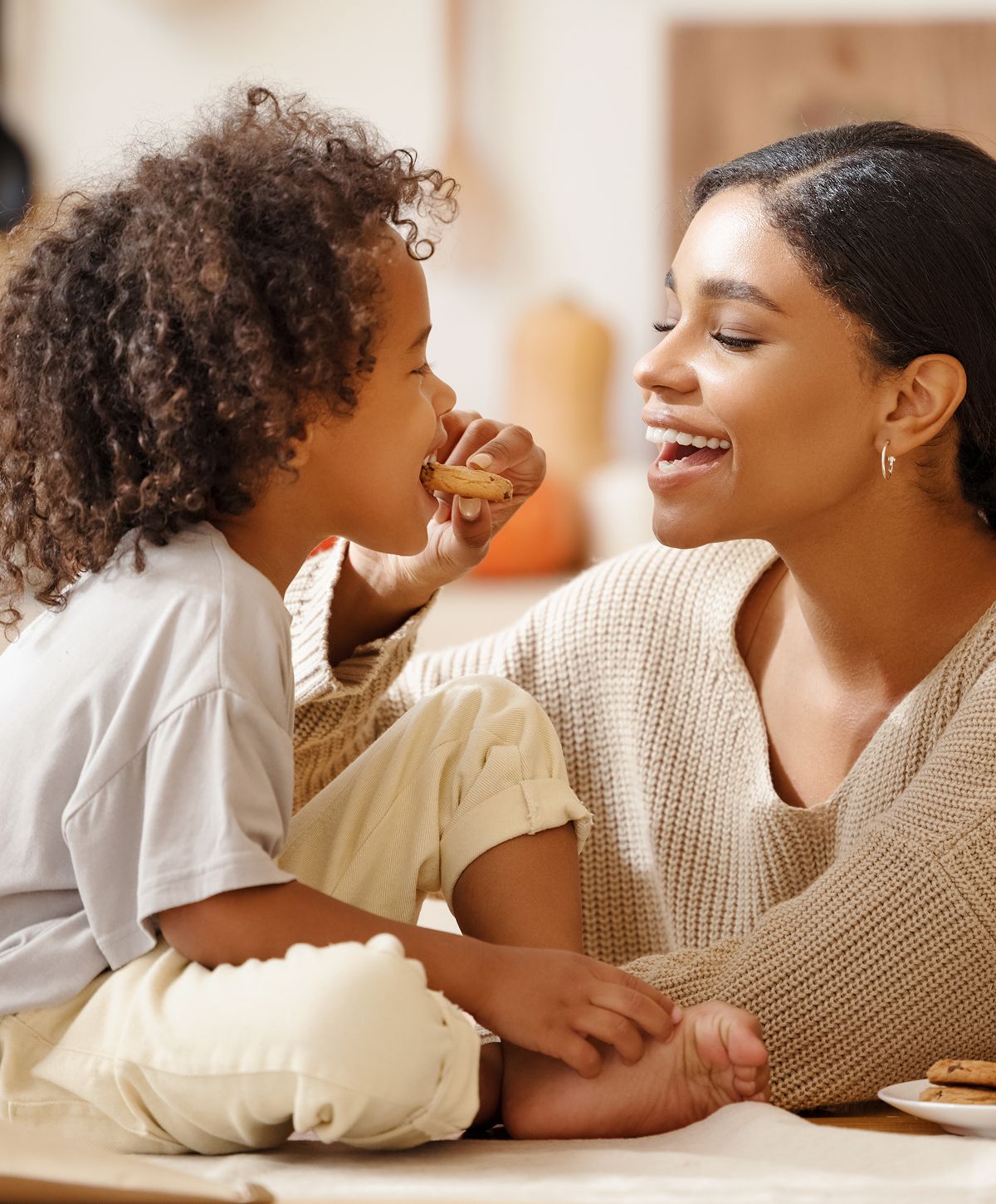 Woman and child interact in a modern setting.