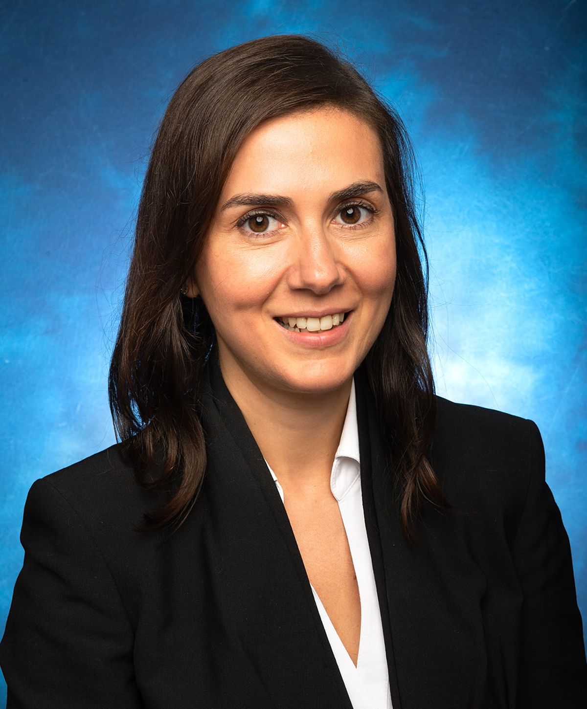 Professional portrait of a smiling woman.