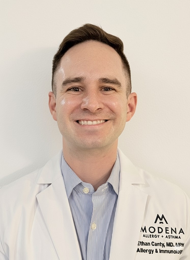 Smiling doctor in a lab coat portrait.