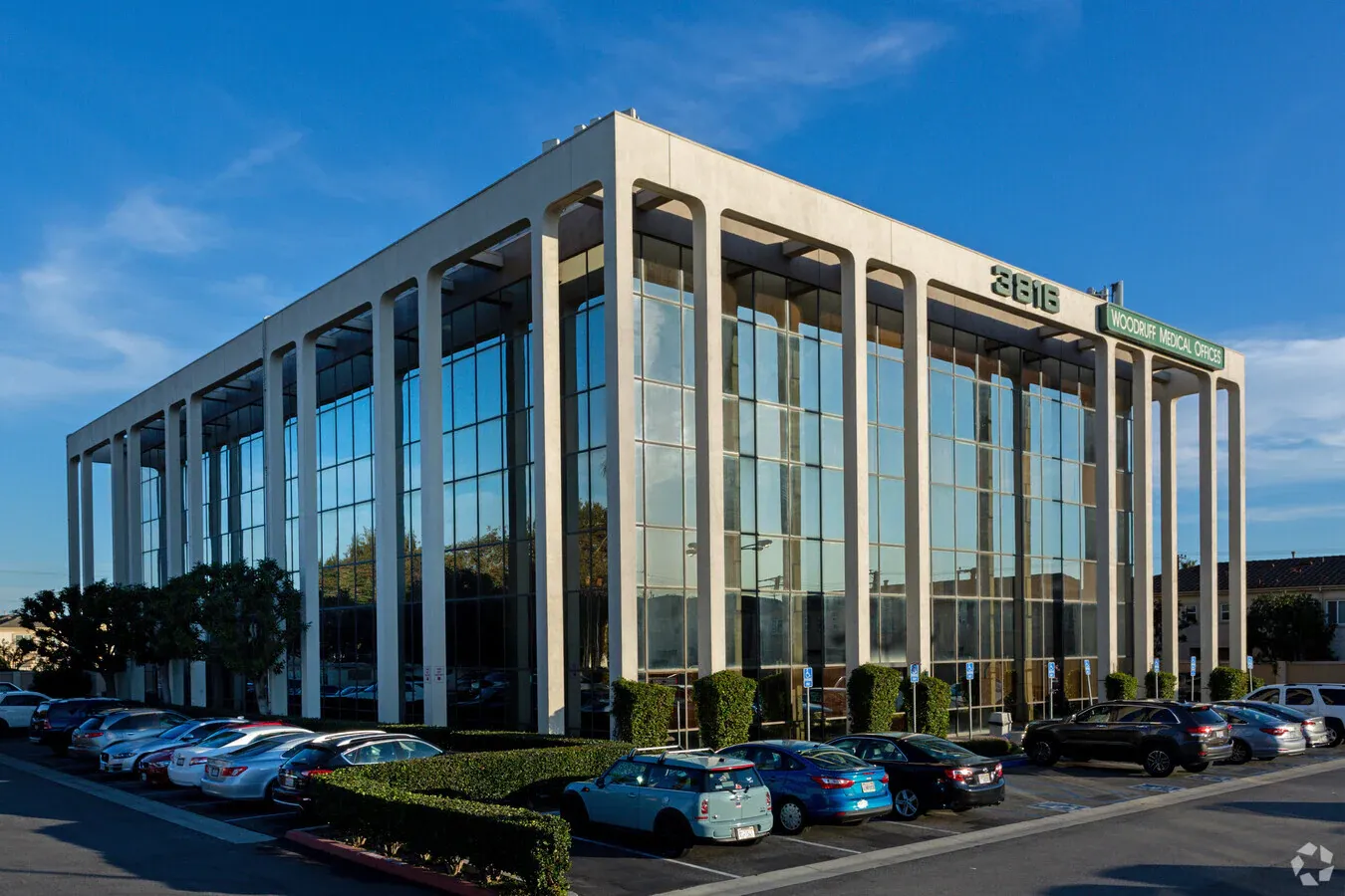 Modern reception area with greenery and decor.