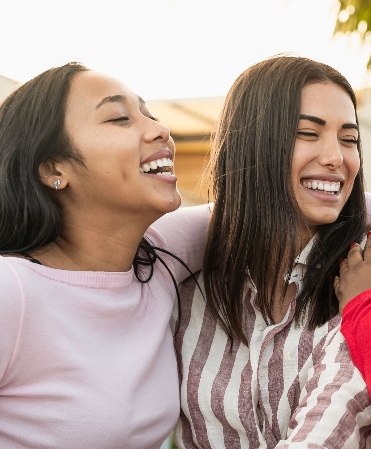 Two smiling women with brown hair