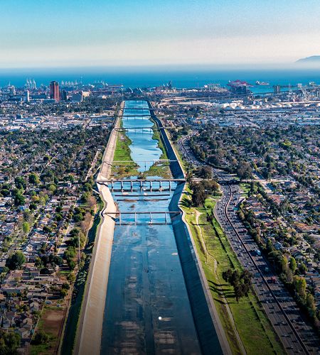 Aerial view of urban river and coastline.