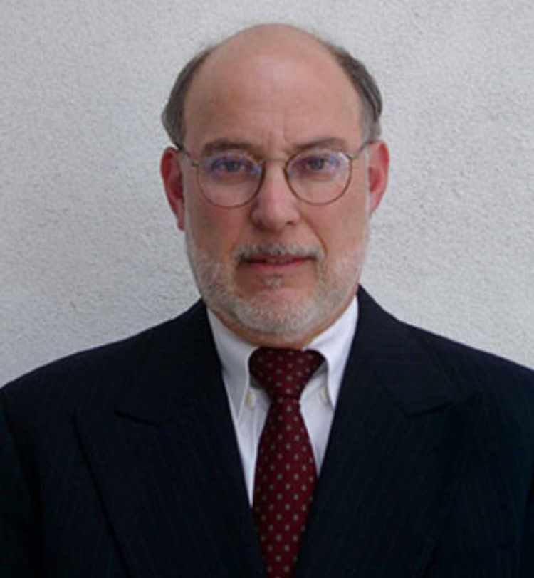 Professional man in a suit with glasses.