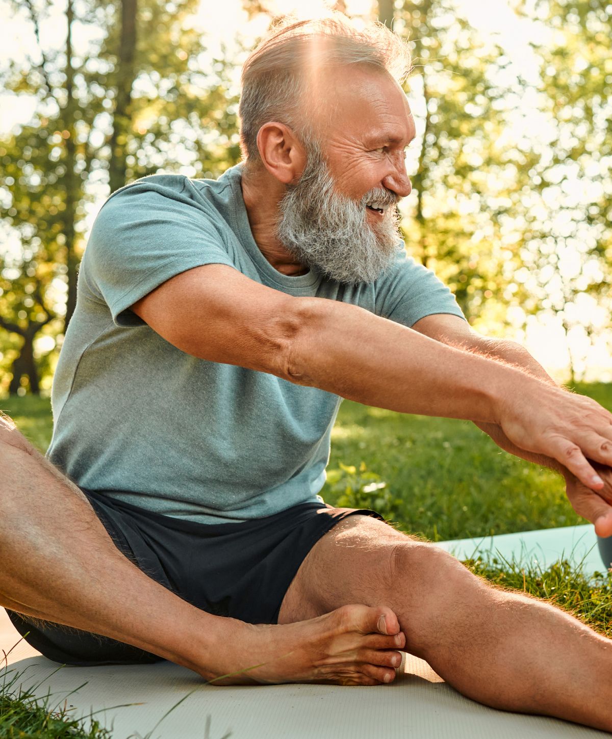 Man stretching outdoors, enjoying fitness in nature.