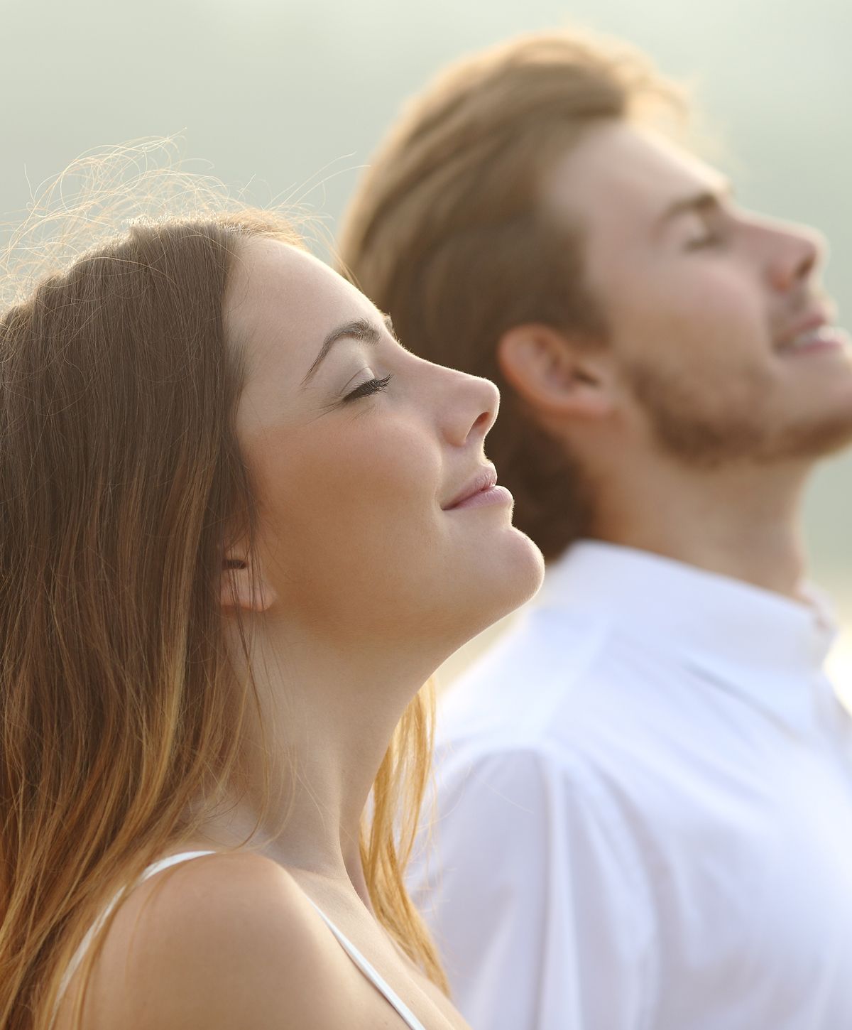 Couple enjoying a serene moment outdoors.