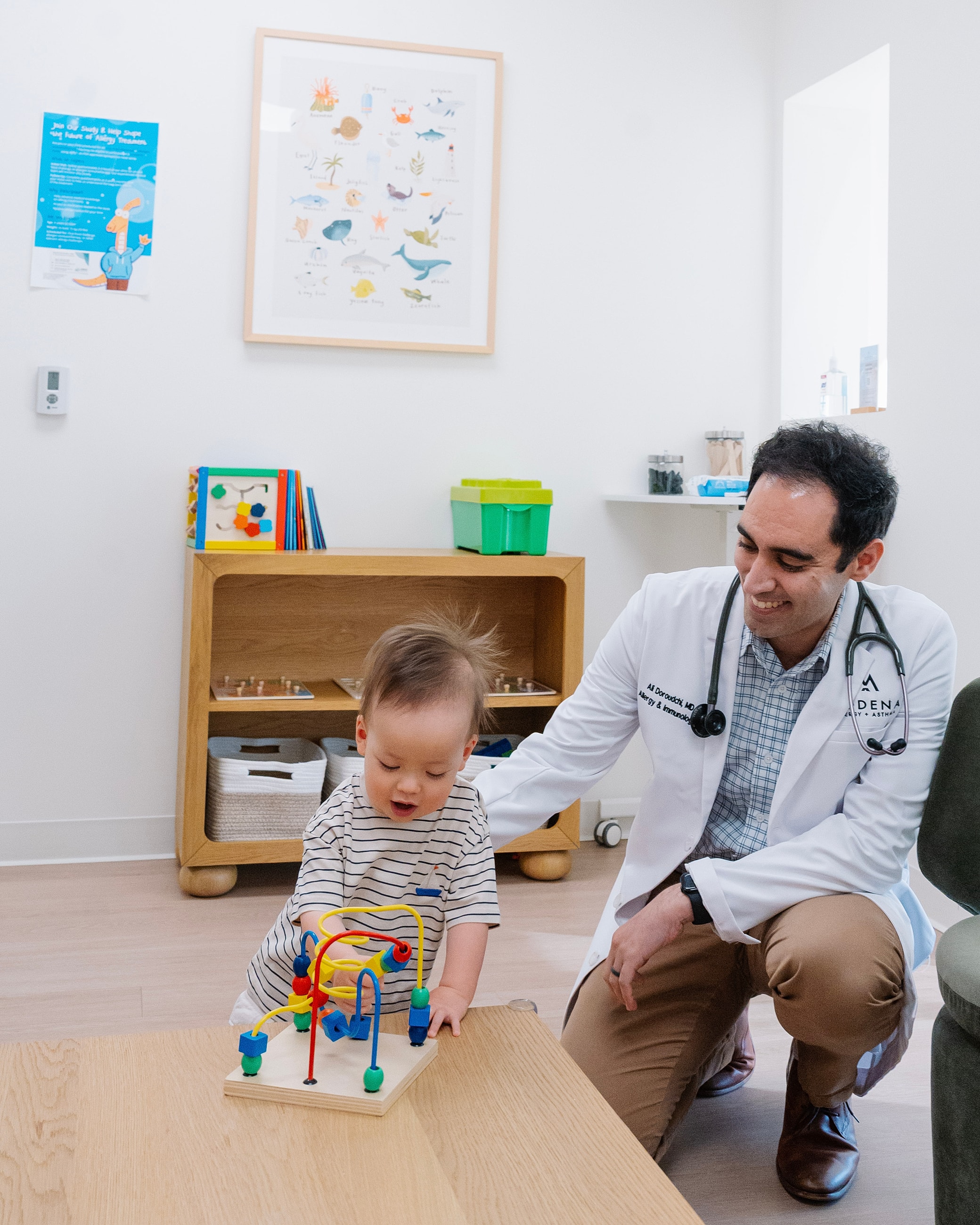 Child playing with toy in doctor's office.