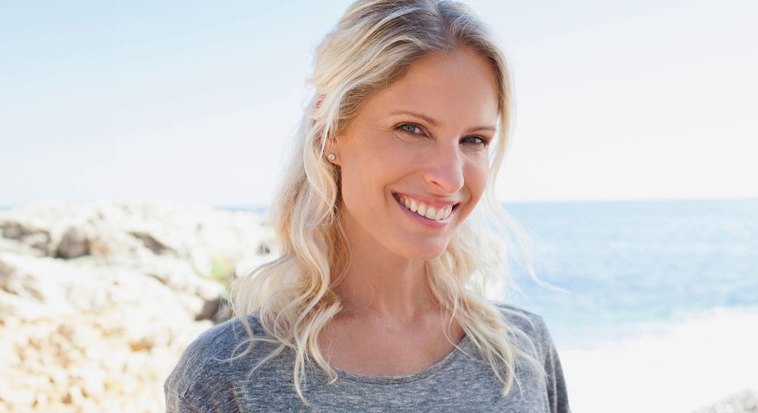 Happy family smiling outdoors together.