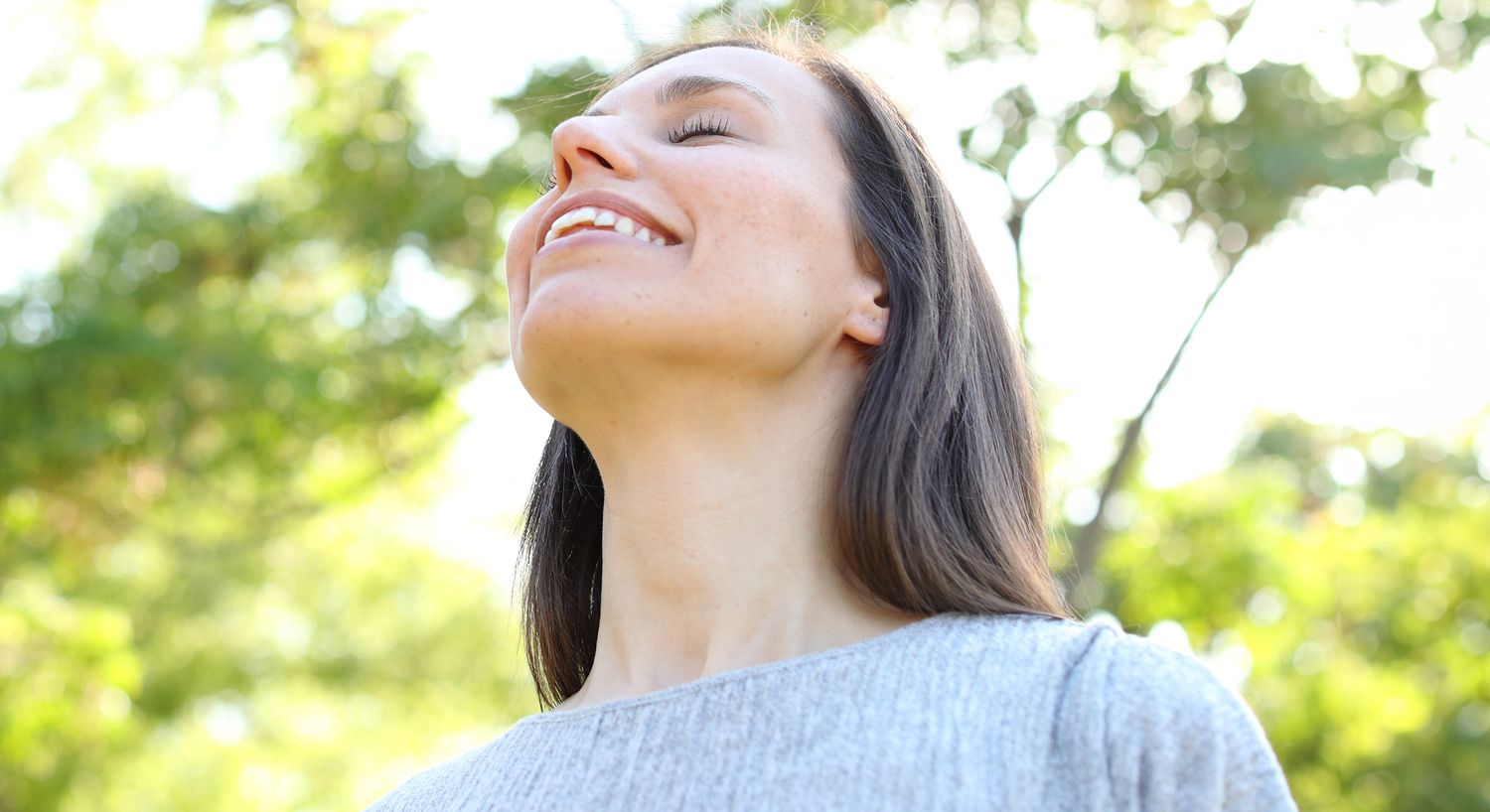Woman enjoying nature and fresh air outdoors.