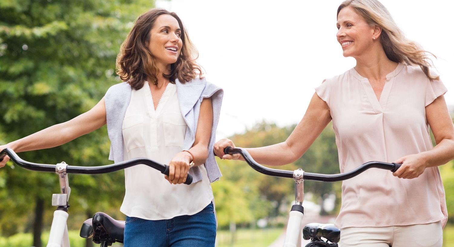 Two women enjoying a bike ride together.